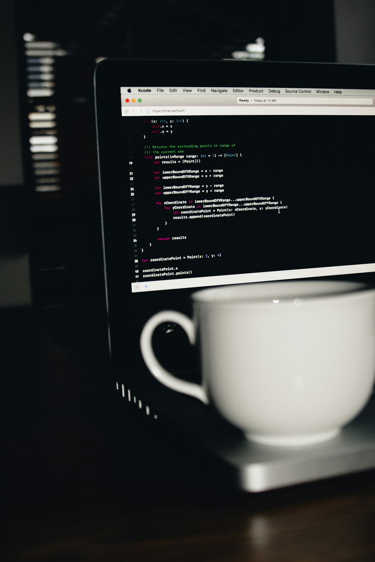 coffee infront of coding laptop