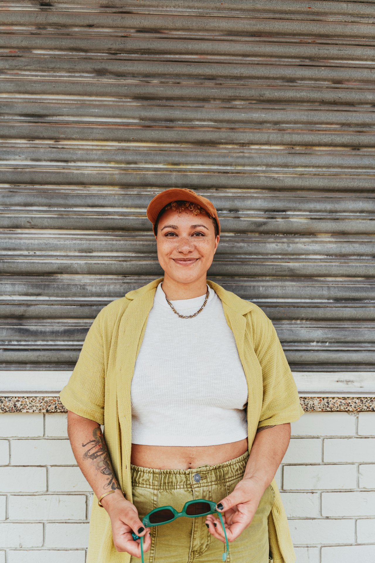woman with hat who is smiling into the camera